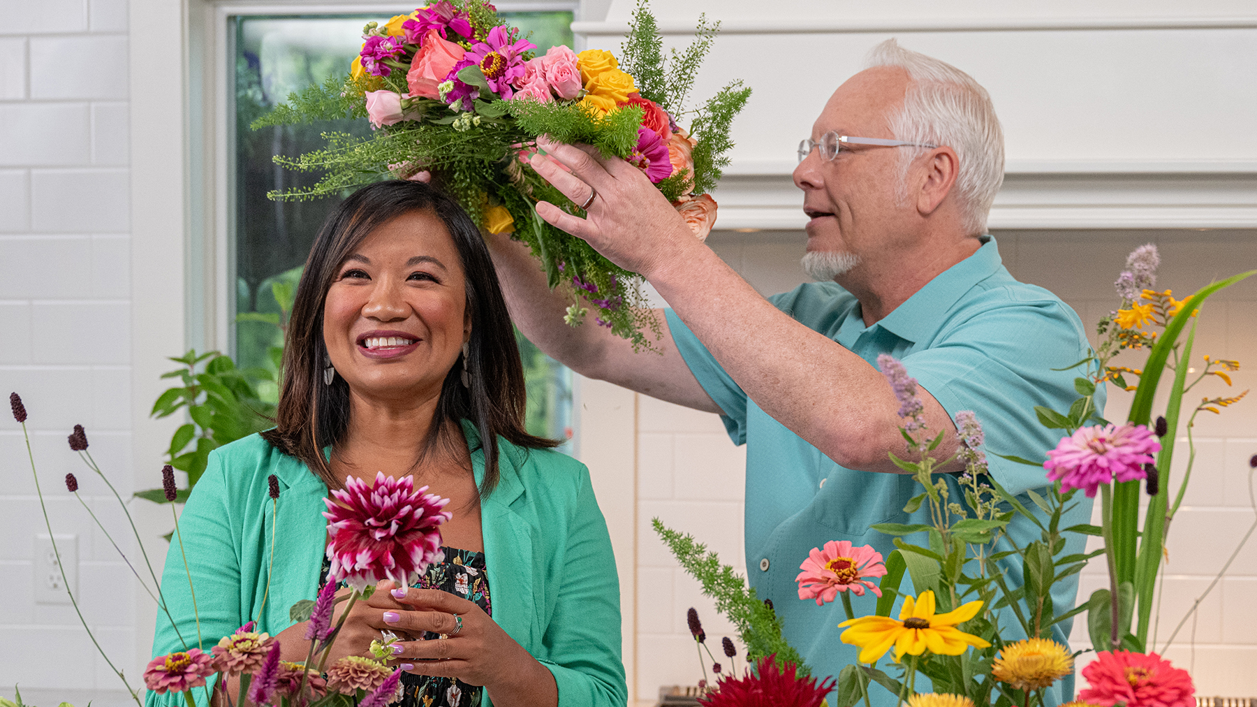 Flower friend Jenn Pascua receives a flower crown after learning how to use a pin flower frog to arrange flowers. Watch J Schwanke’s Life in Bloom, airing on public television stations nationwide.